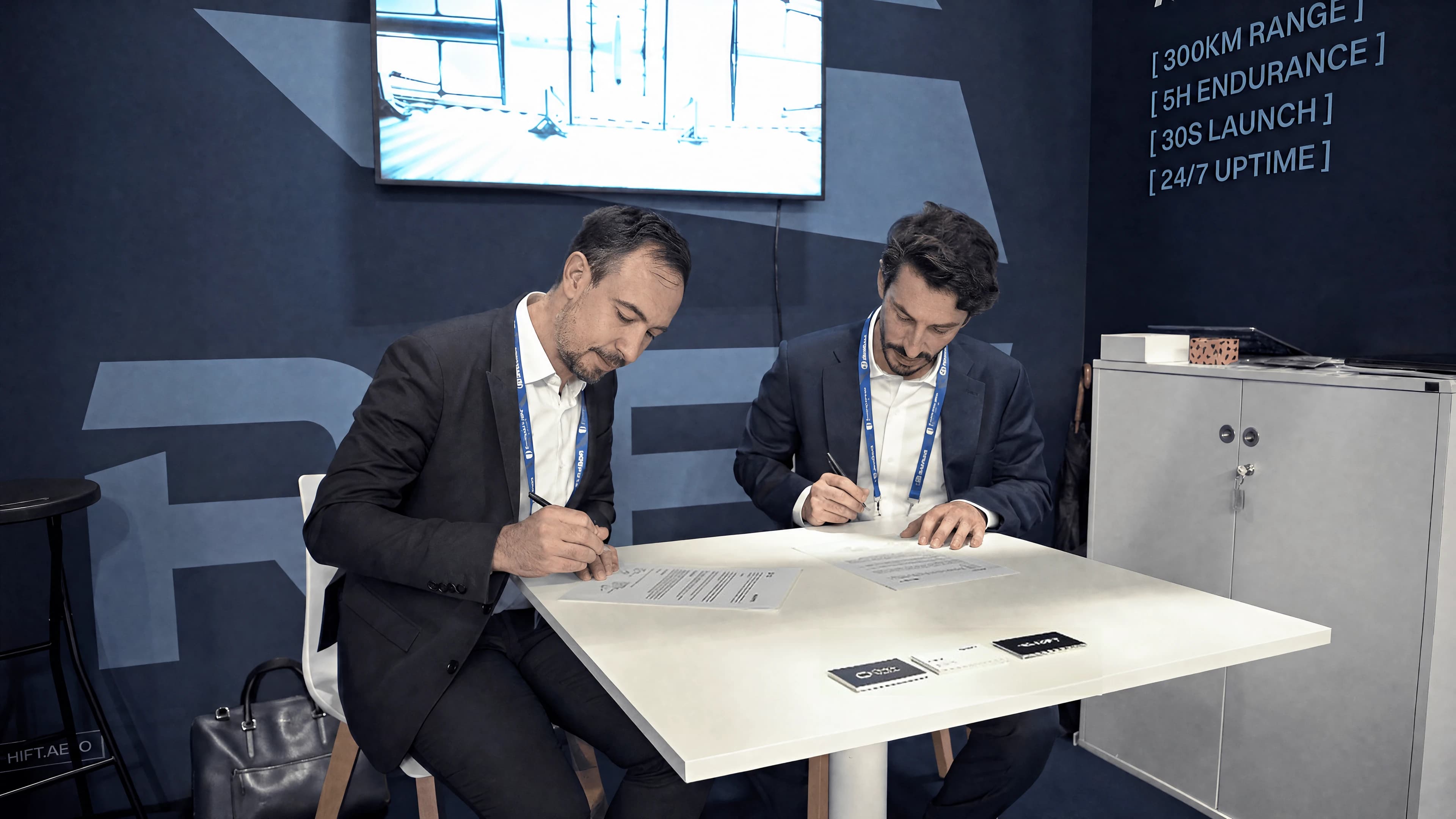 Rift and ChapsVision representatives signing their partnership agreement at the Rift booth